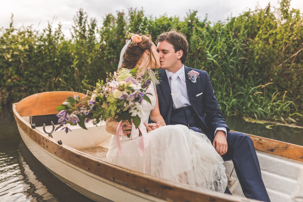 A newly married couple in a vintage rowing boat on the moat at The Reid Rooms. A newly married couple in a vintage rowing boat on the moat at The Reid Rooms.