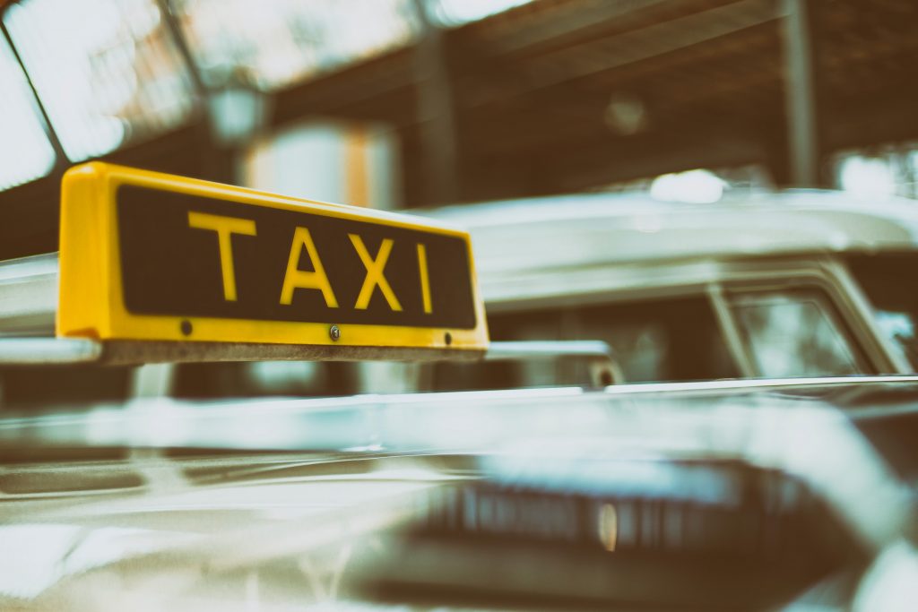 Link to a list of The Reid Rooms recommended suppliers for local taxi firms Close up of a taxi sign