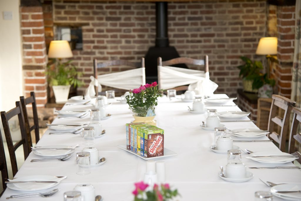 The breakfast table laid out at Marks Hall Farmhouse for wedding guests. The breakfast table laid out at Marks Hall Farmhouse for wedding guests.